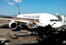 Singapore Airlines Spontaneous Escapes: 30% Off Award Flights Around The World a large airplane parked at an airport