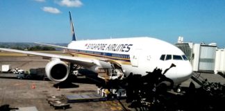 Singapore Airlines Spontaneous Escapes: 30% Off Award Flights Around The World a large airplane parked at an airport