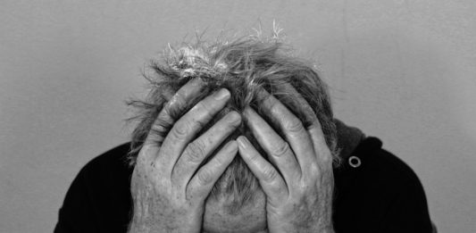 a man holding his head