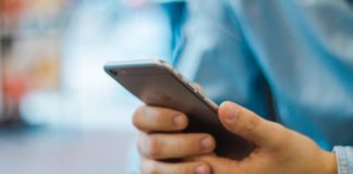 United MileagePlus Cardmembers Can Now Earn Miles on Rent Payments with Bilt a person holding a cellphone