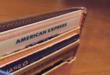 How I Racked Up Over $8,000 In Credit Card Annual Fees Last Year a wallet with cards inside