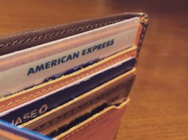 Image of credit cards in a wallet as we discuss what happens to your status benefits if you close a credit card