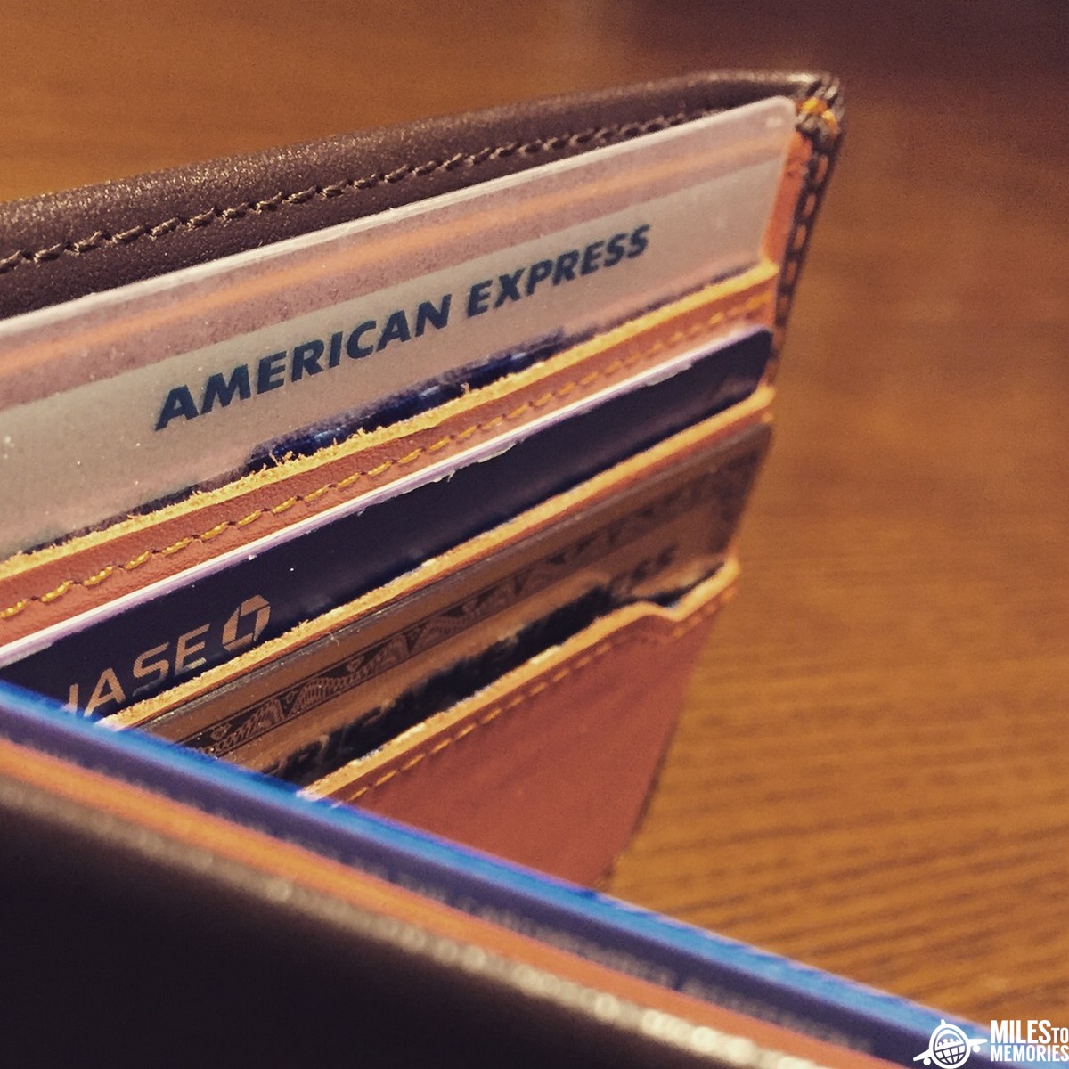 Image of credit cards in a wallet as we discuss what happens to your status benefits if you close a credit card