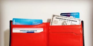 Last Chance To Lock In CardPointers’ Valuable Service For Half Off! a red wallet with credit cards and cards inside