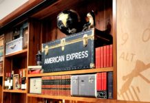 They Live! A Few American Express Card Benefits I Still Enjoy a shelf with books and a box on it