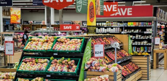 a grocery store with fruit in boxes