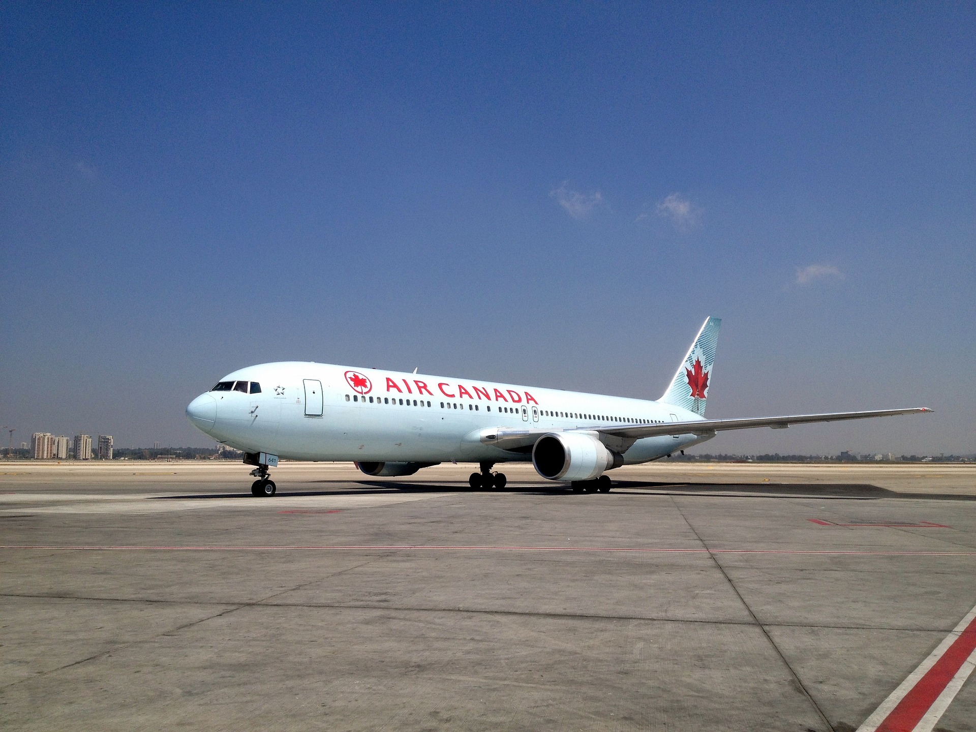 Air Canada plane featured here; the airline has many partners through which you can earn miles to fly for free