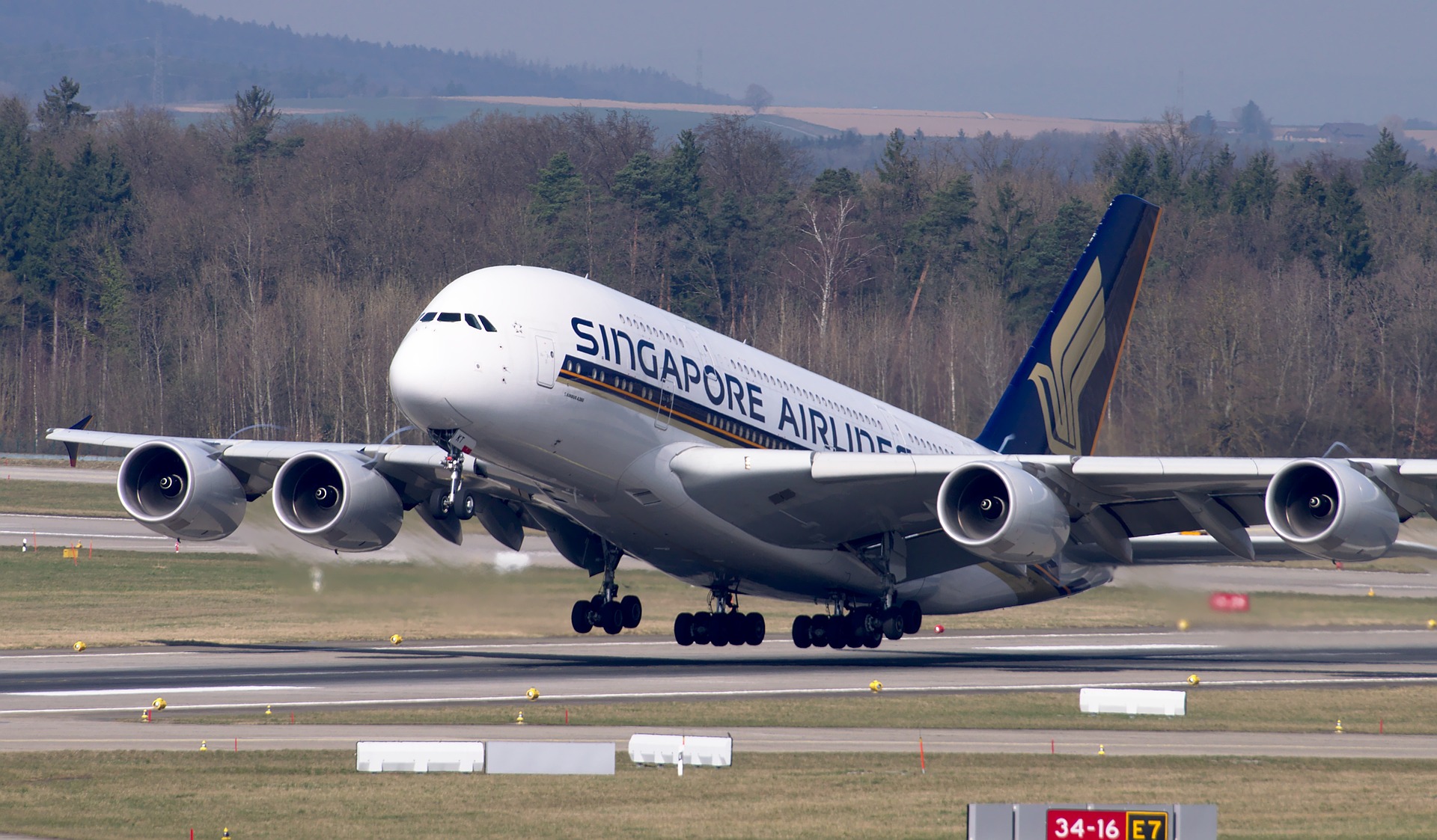 Singapore Airlines charges standard fees for traveling with a child on your lap