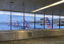 Just Right – American Airlines Premium Economy (DFW-OGG) Highlights a window with airplanes in it