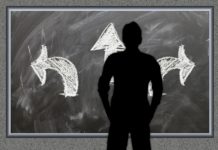 On Loyalty – Considering the Latest Hilton Honors Changes a man standing in front of a chalkboard