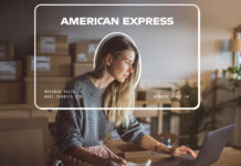 Amex Launching New Business Card with $250 Annual Fee? a woman sitting at a desk with a laptop