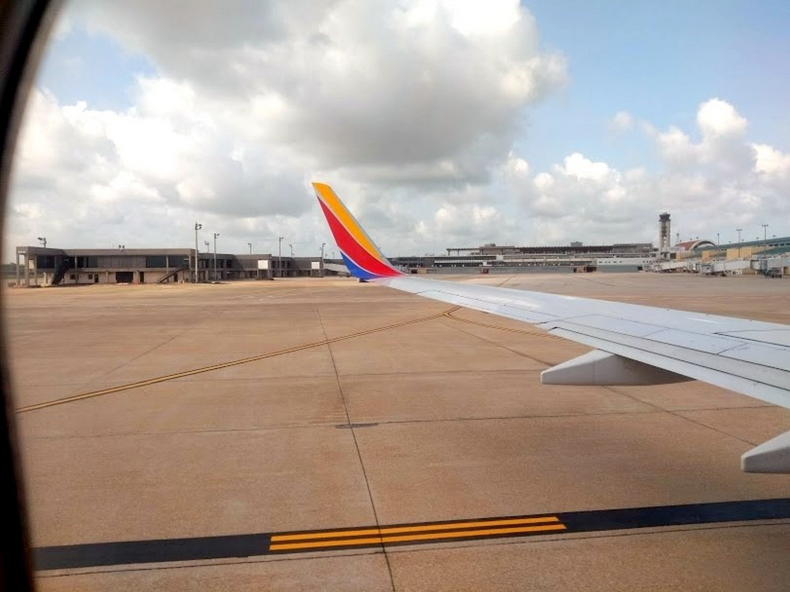 the wing of an airplane on a runway