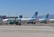 Frontier Airlines Giving Away 70 Million Miles a group of airplanes on a runway
