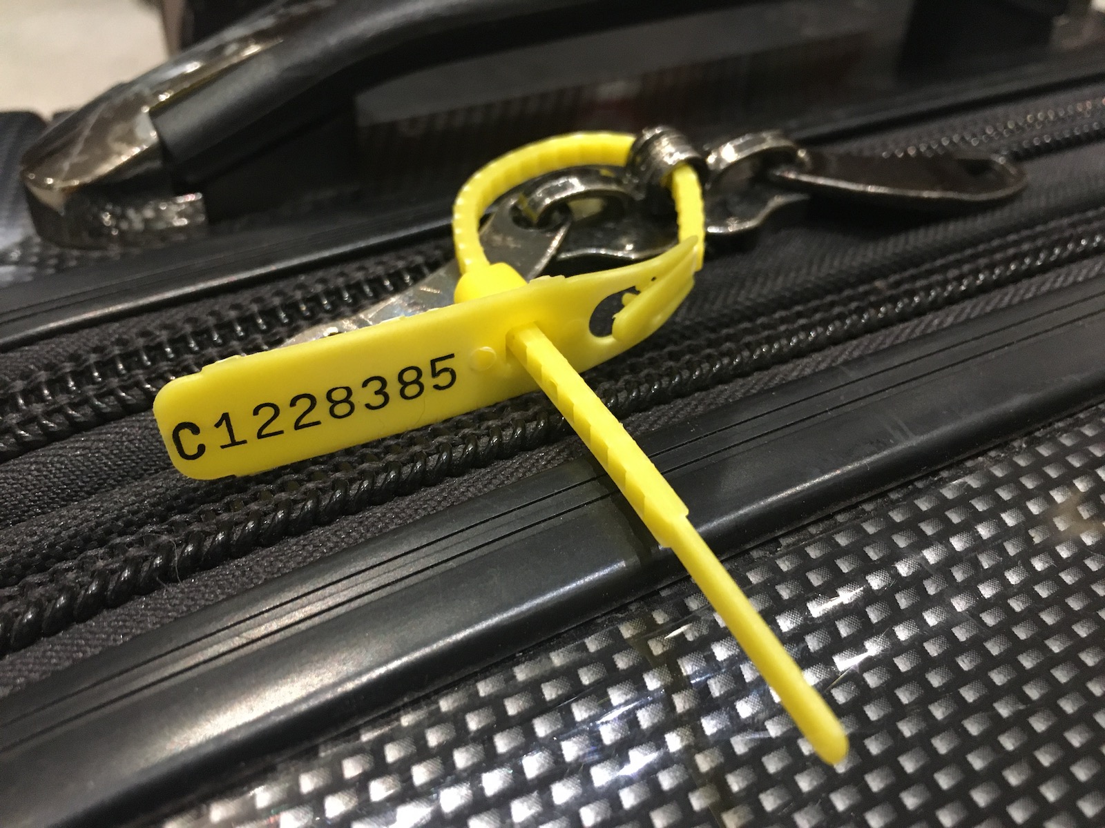 Numbered zip ties to see if someone opened your checked bag