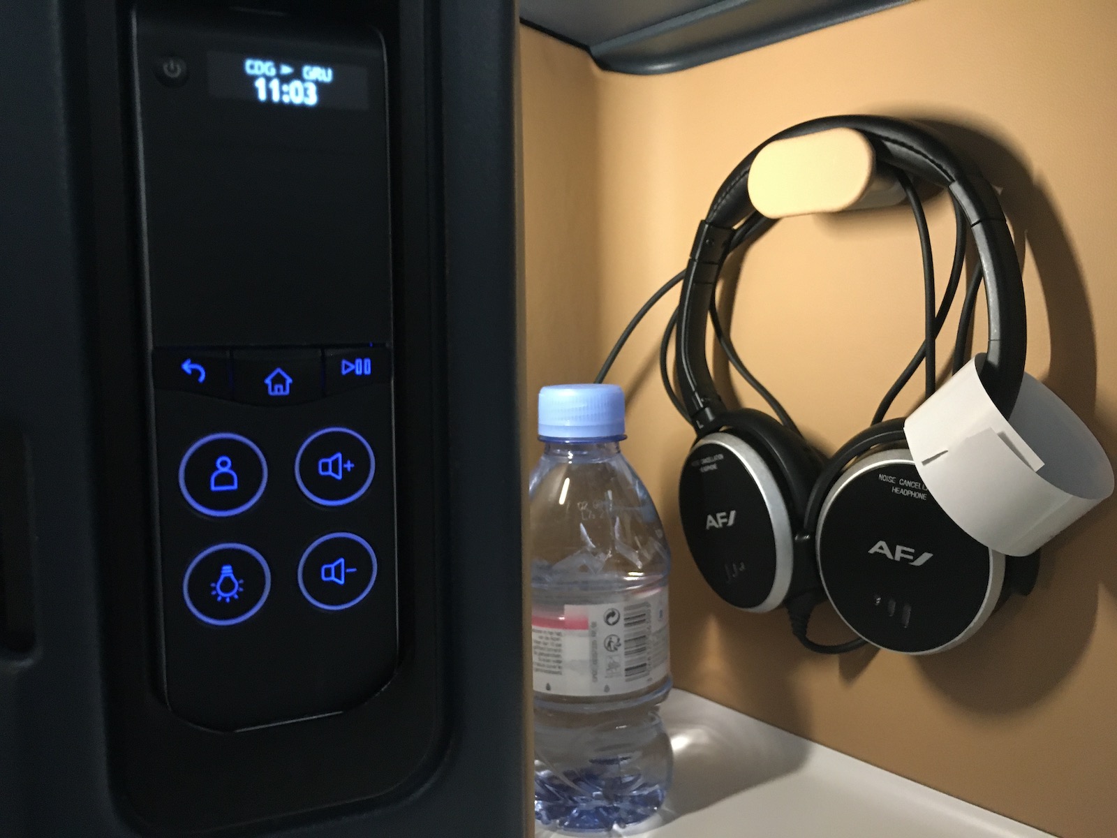 Controls and cubby on business class seat