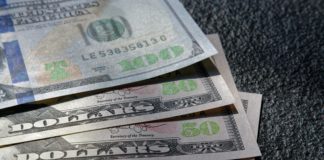 Show That Teen In Your Life They Don’t Know Everything With This $125 Checking Bonus a stack of money on a table