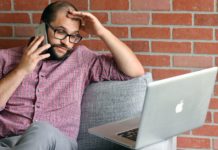 Whoa, Whoa, Whoa: How This Big Spend Method Bit Back a man sitting on a couch with a laptop and phone