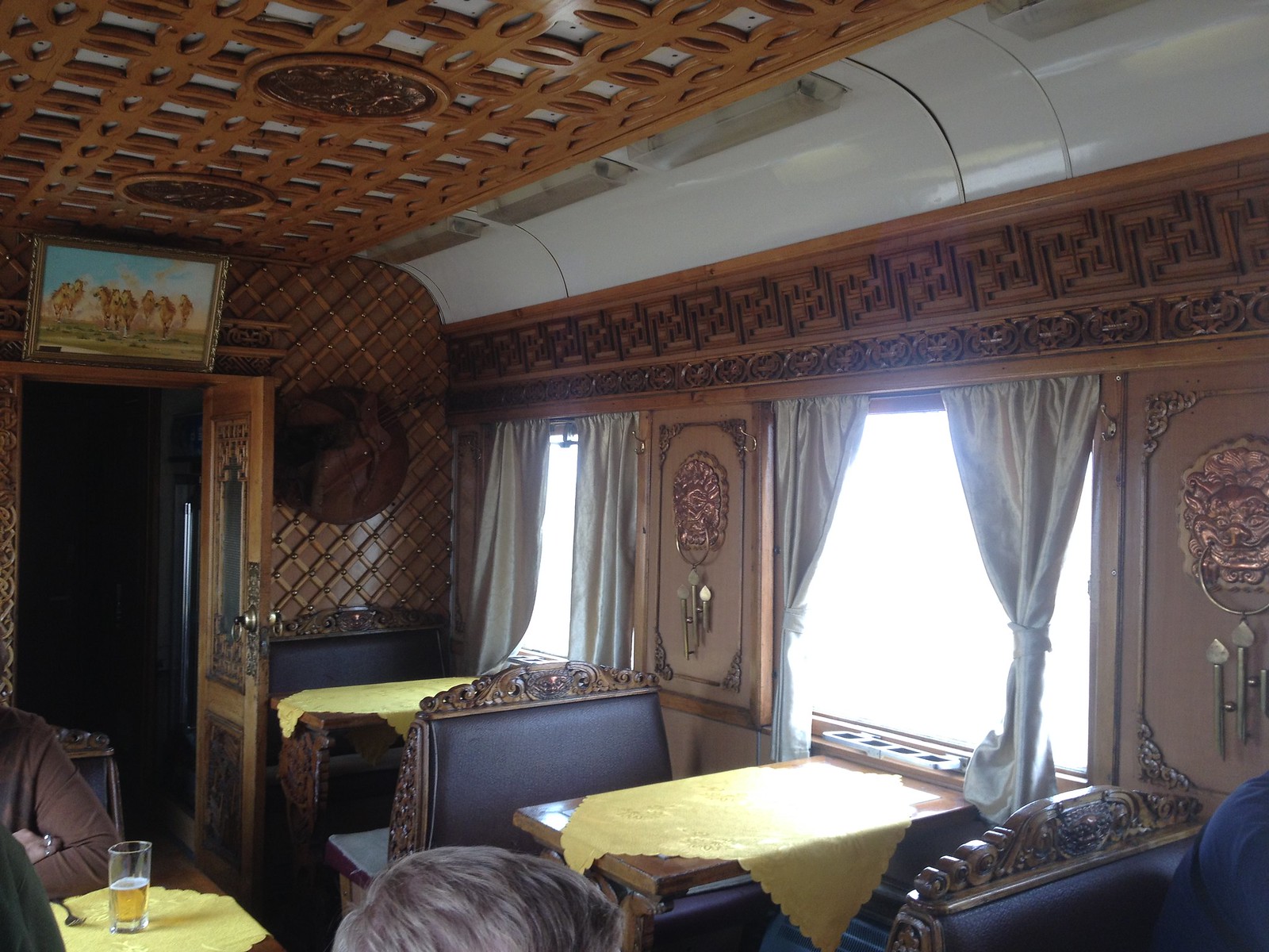 You could use your points to ride luxury trains like the Trans-Mongolian (dining card pictured here)