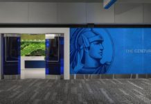 Maximize Your Business Platinum Card With These 30 Different Perks a wall with a picture of a man on it