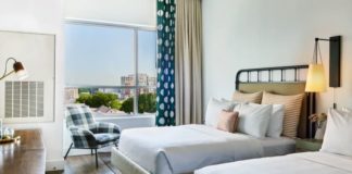 Earn 60,000 Bonus Points with Wyndham Timeshare Offer a room with two beds and a chair