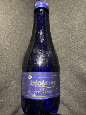 a blue bottle with a label