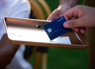 Image of hand holding Capital One credit card