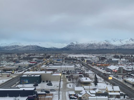 Views from the window showing buildings and mountains in the distance, part of review of Sheraton Anchorage