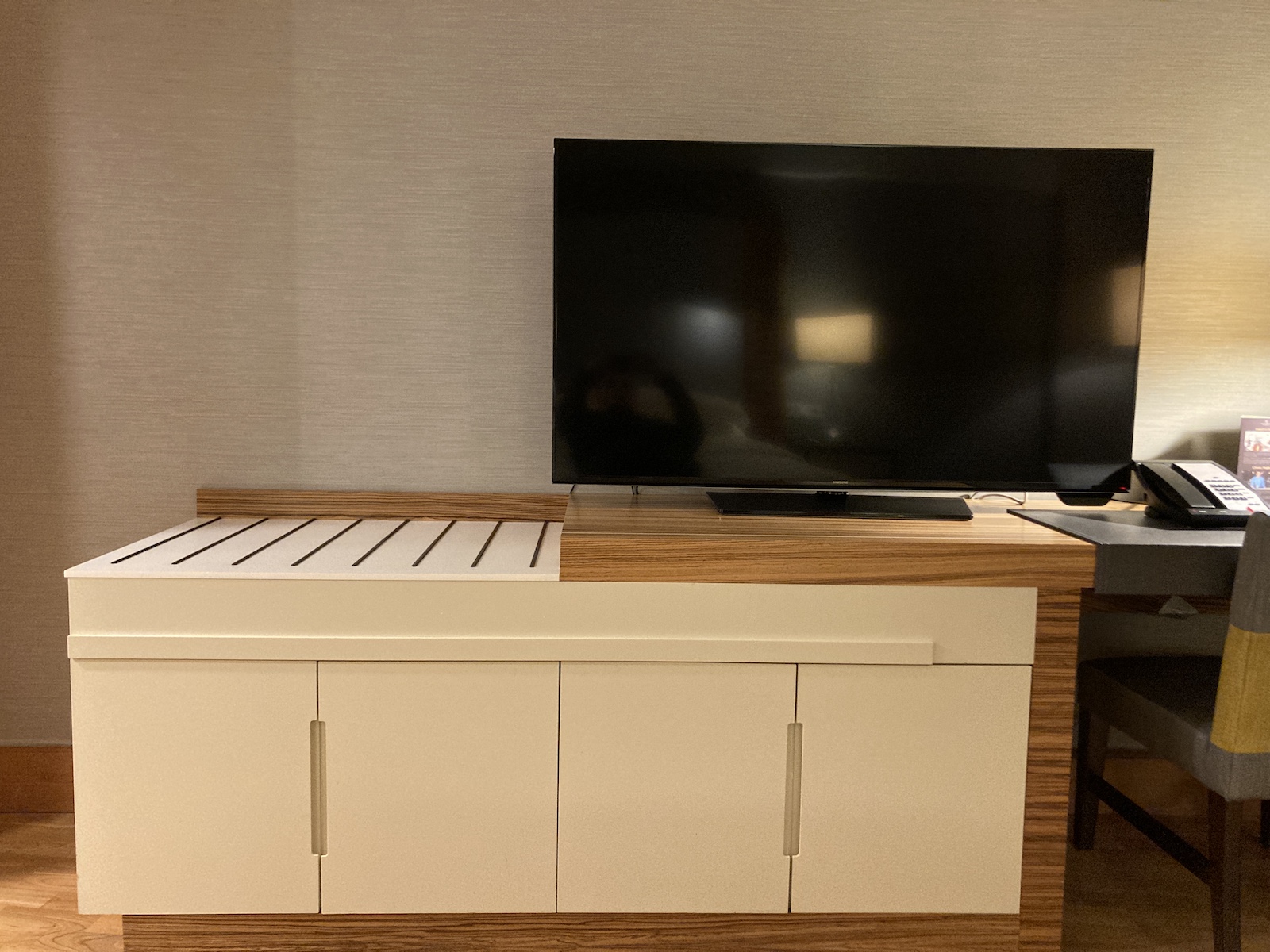 Image of dresser and TV in panoramic suite bedroom