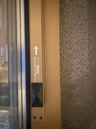 Image shows latch on door to balcony in the guest room