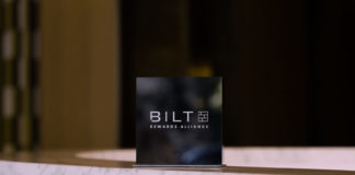 Bilt Launches New Rakuten Partnership That Makes it Easier to Earn Points a black sign on a marble surface