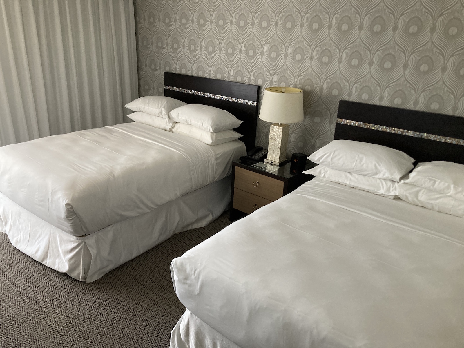 Image of two beds in a hotel room
