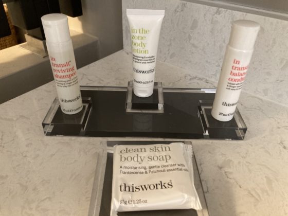 Toiletries sit on a sink counter