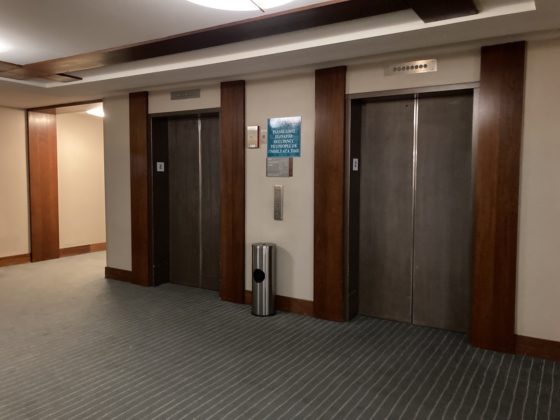 Photo of elevator waiting area in Kamehameha Wing of Waikoloa Beach Marriott Resort Spa, main floor near lobby, shows 2 closed elevator doors