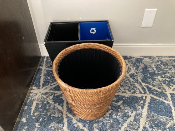a trash can and recycling bins