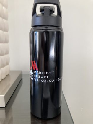 Photo of black water bottle with Waikoloa Beach Marriott Resort Spa written on it