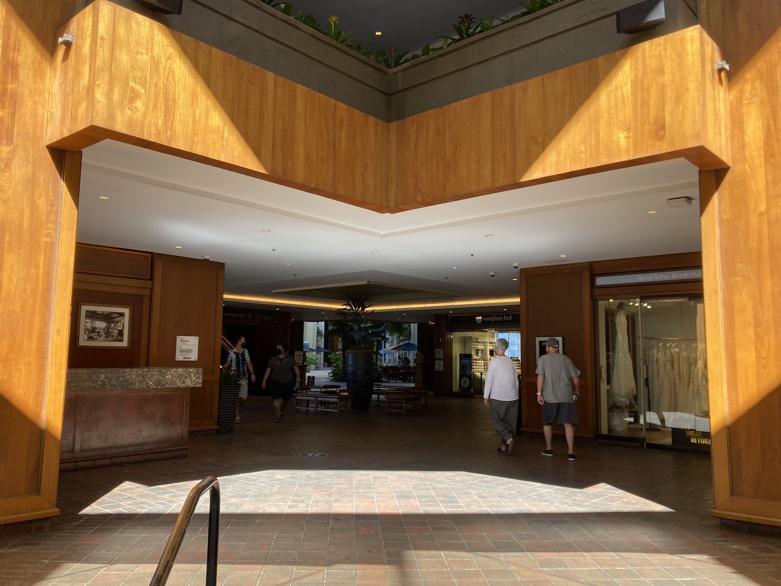 View of main entrance to Hyatt Regency Waikiki with people coming toward the exit