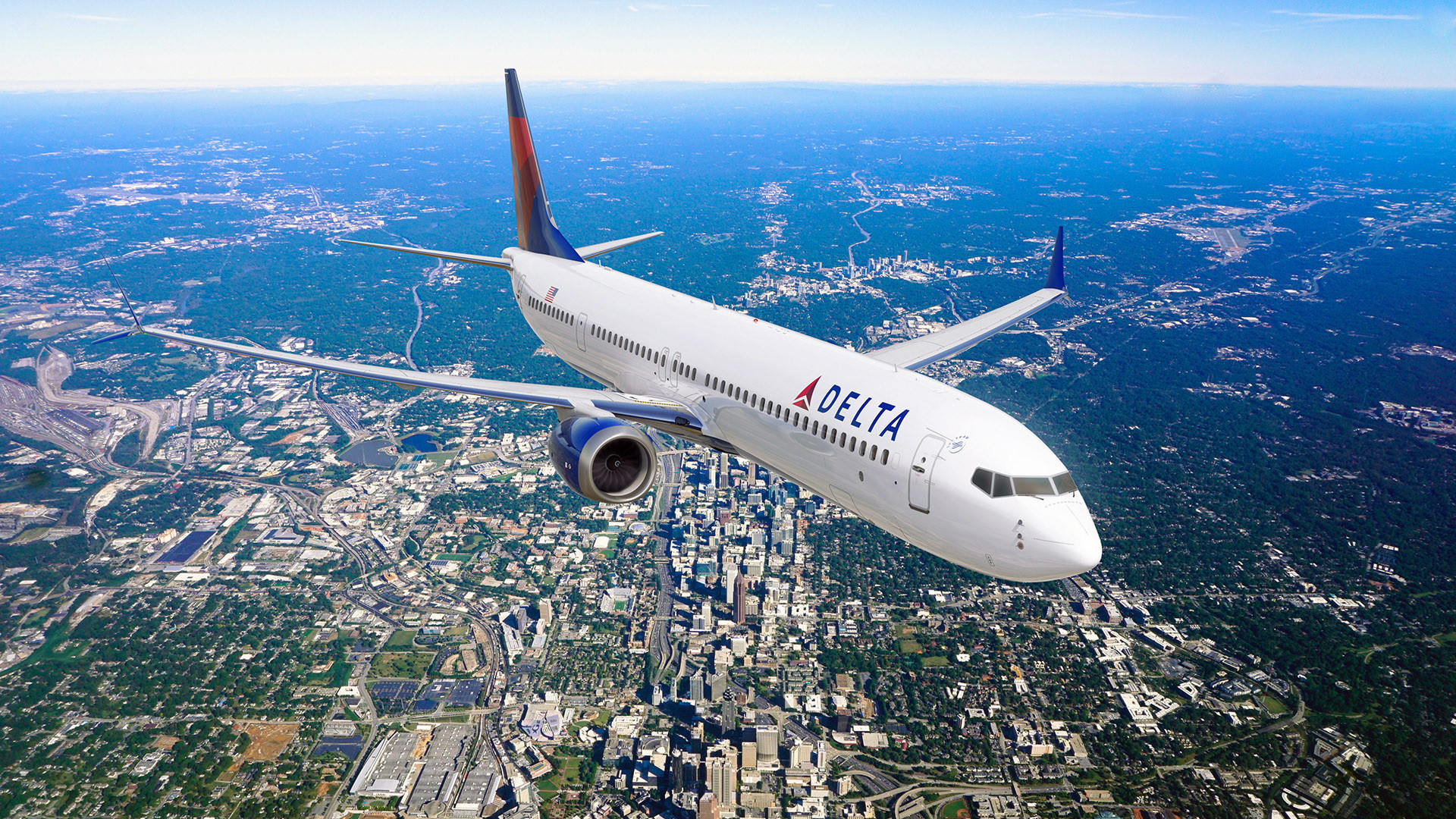 an airplane flying over a city