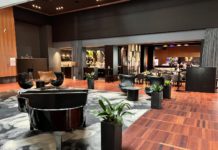 Choice Privileges Announces an All-New Rewards Experience and Titanium Status a room with chairs and piano