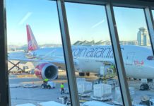 New Virgin Atlantic Promotion Rewards Loyal Members with 12,000 Bonus Points a large airplane at an airport