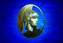 What’s the Best “New” American Express Card Benefit? a gold emblem with a man's face