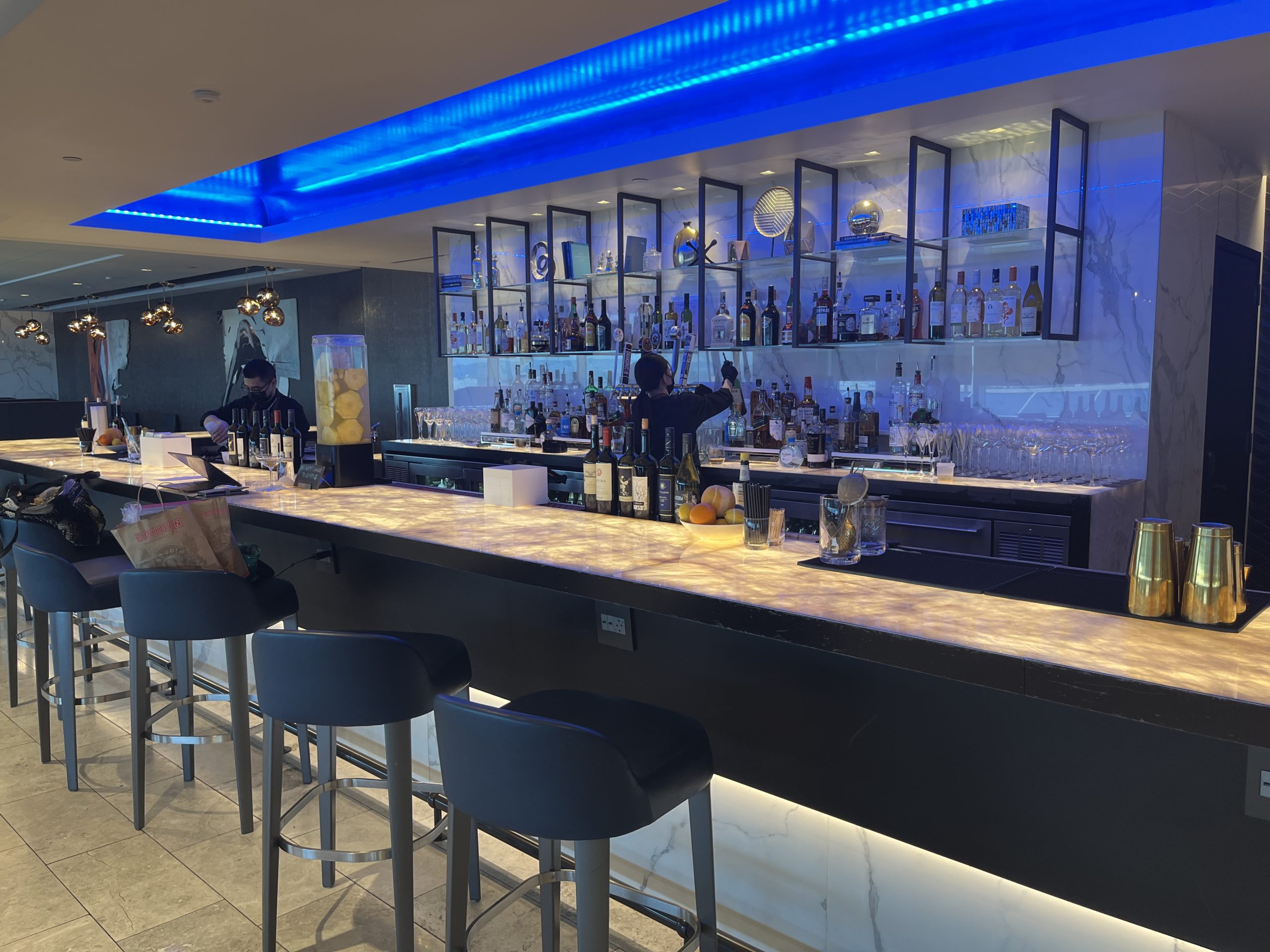 a bar with a counter and bar stools