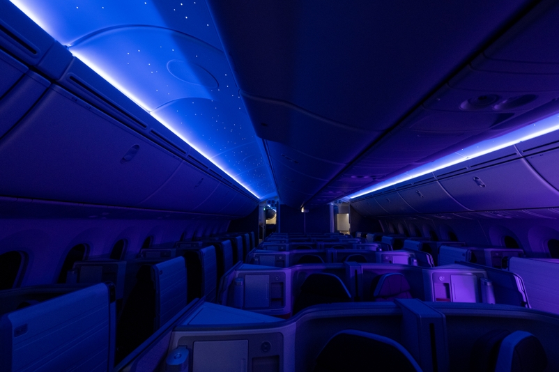 an inside of an airplane with blue lights