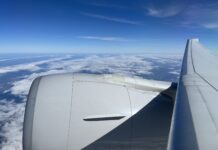 New United Airlines Mile Play Promotion Offers Worth Up To 40,000 Miles a plane wing with clouds in the background