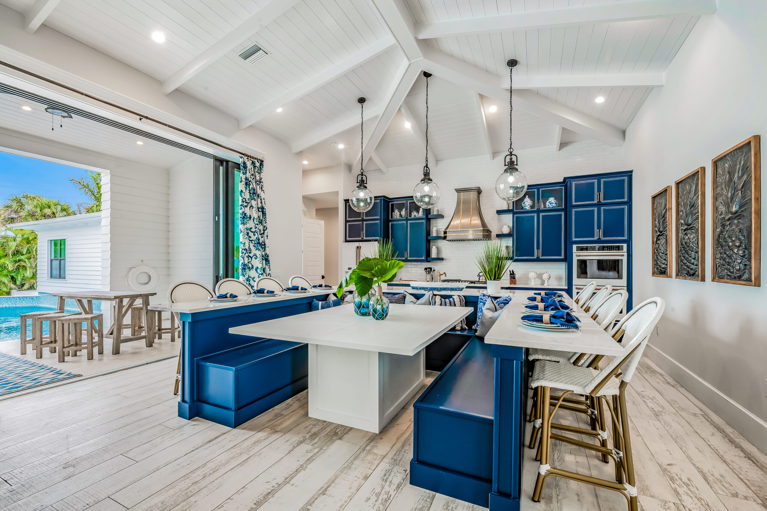 a kitchen with blue cabinets and white walls