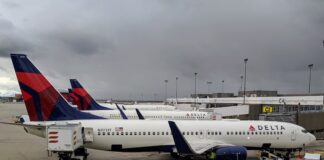 How to Find This Better Offer for Amex Delta Gold Card: 60,000 Miles + $500 Credit a group of airplanes at an airport