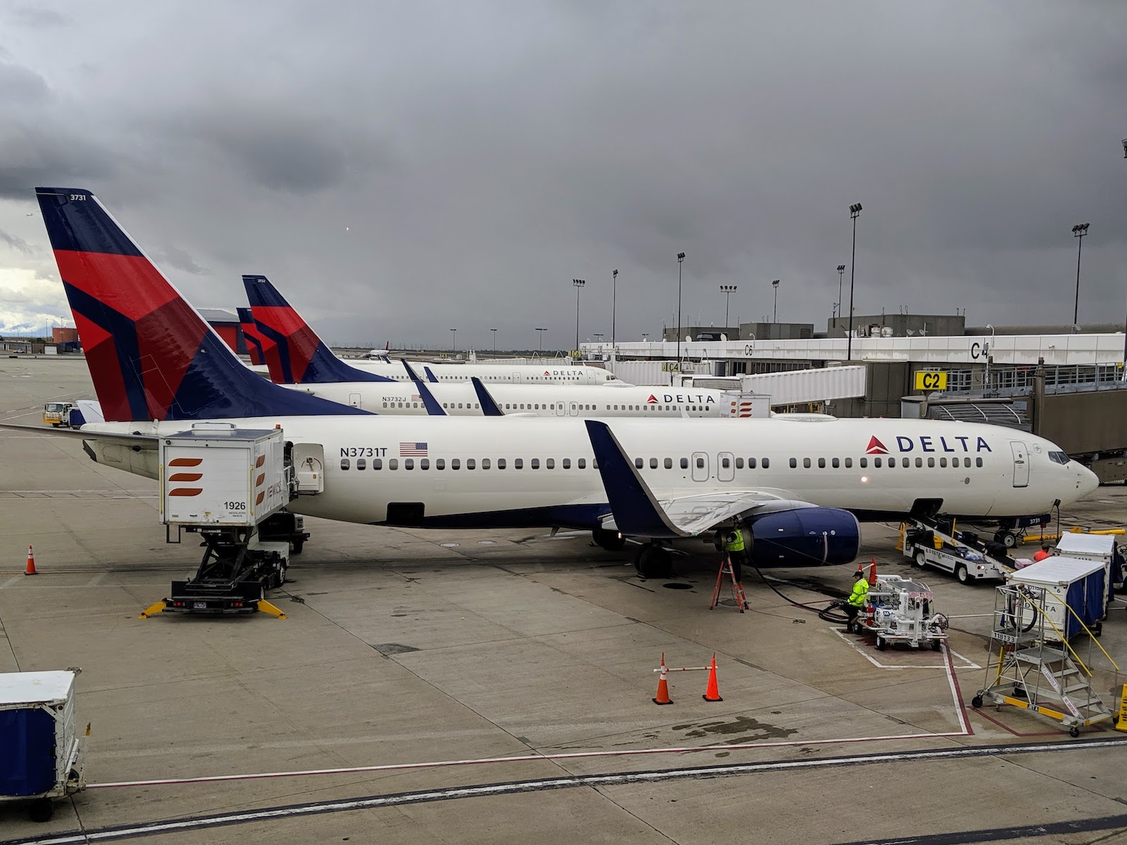 a group of airplanes at an airport