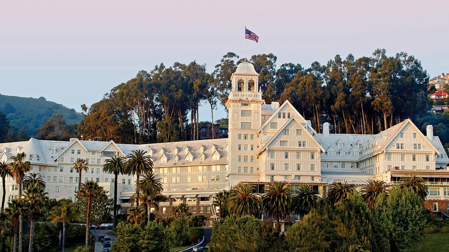 a large white building with a flag on top