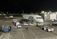 JetBlue Premier Cards Adds New Benefits: 25-Tile Bonus, Companion Pass, $300 Credit and More an airplane on the tarmac at night