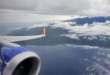 Ends Soon! Earn Companion Pass With One Southwest Business Card Bonus an airplane wing and engine above clouds