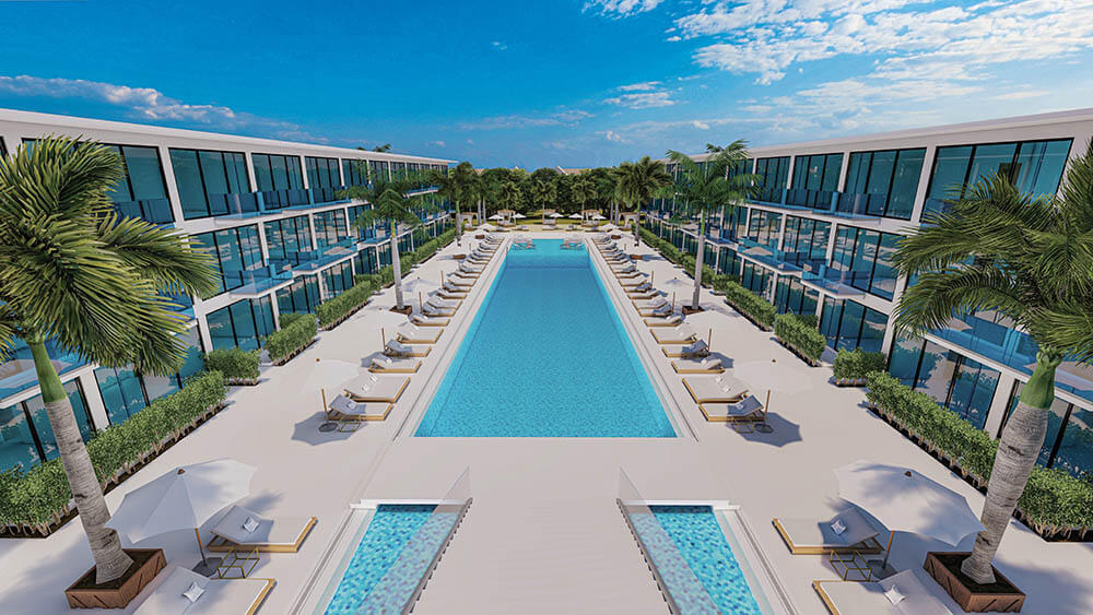 a pool and lounge chairs in a hotel